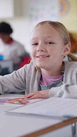 smiling girl student drawing in a classroom