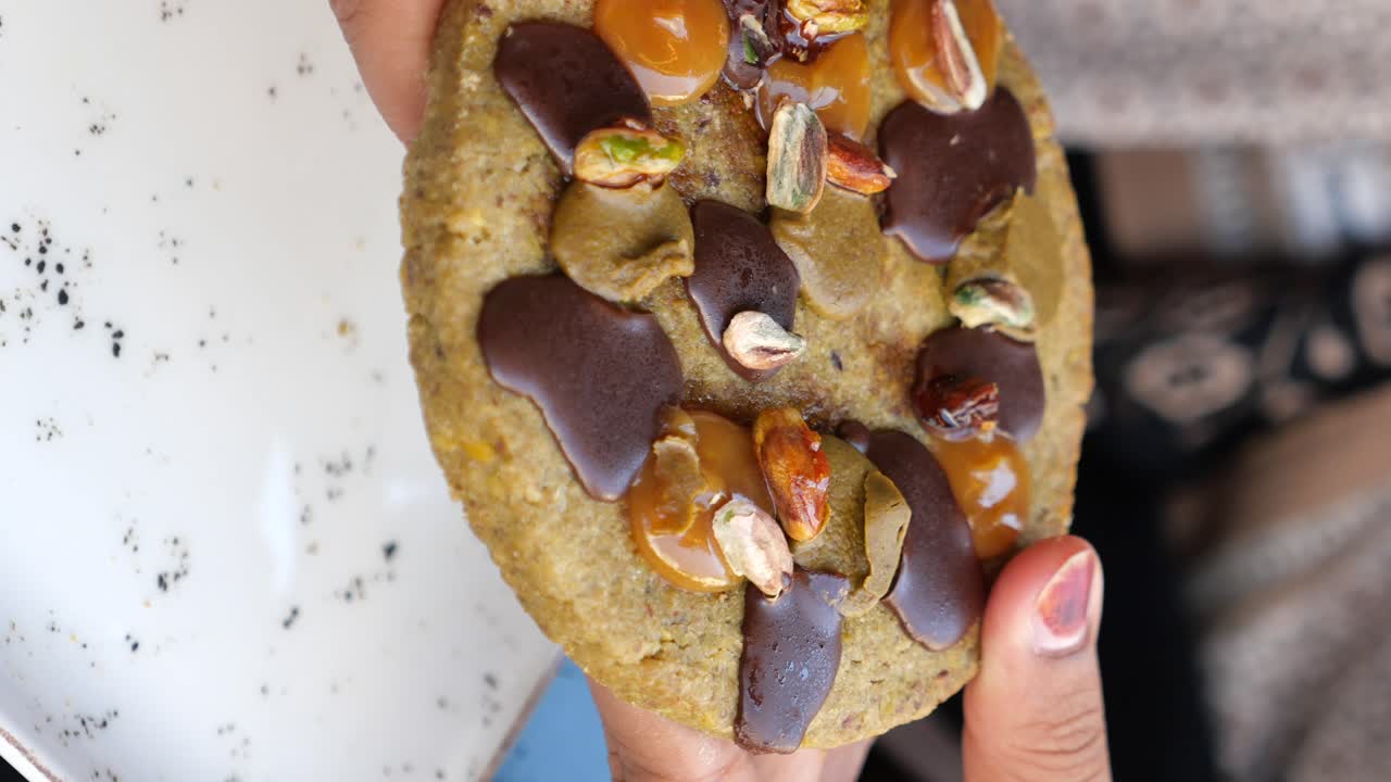 Cookie with chocolate, caramel, and pistachios
