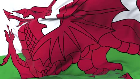 wales flag waving at wind in slow with blue sky, loop