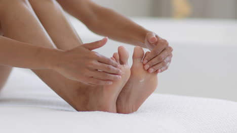 woman stretching her feet