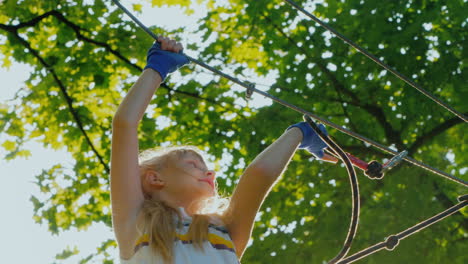 Active-Child-Fearlessly-Climbs-The-Ropes-Between-The-Trees