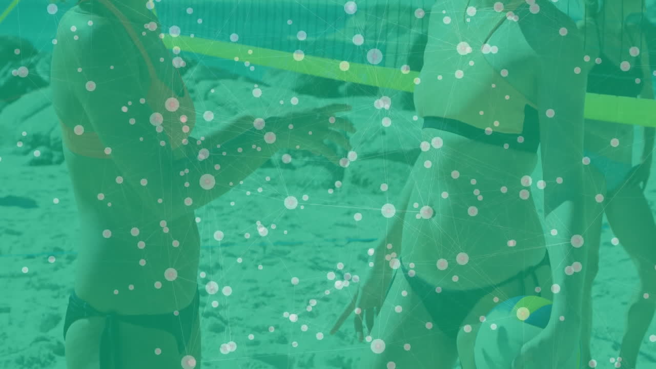 Playing beach volleyball, athletes with digital data animation overlaying scene