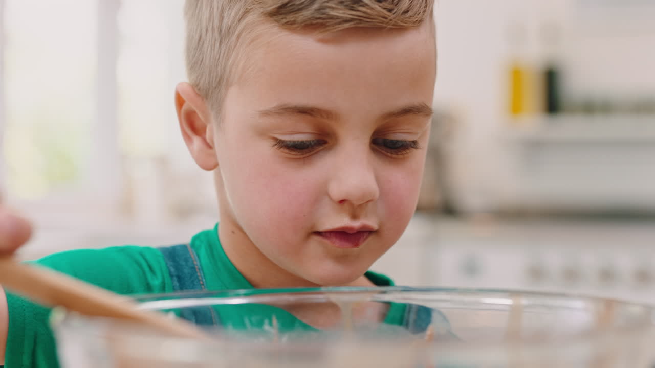 Child Eating Chocolate From a Wooden Spoon
