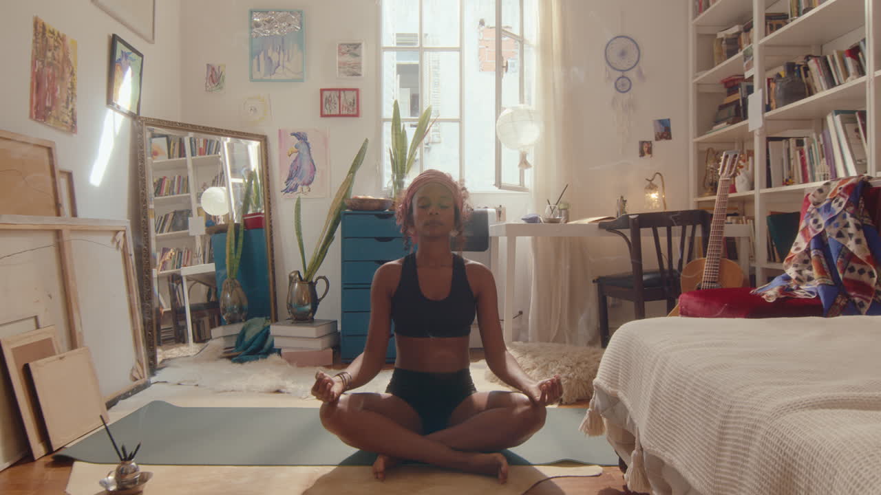 Young Black Woman Practicing Yoga Meditation at Home