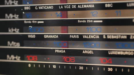 old retro am fm radio with tubes, hand changing stations , bulb vintage music player.