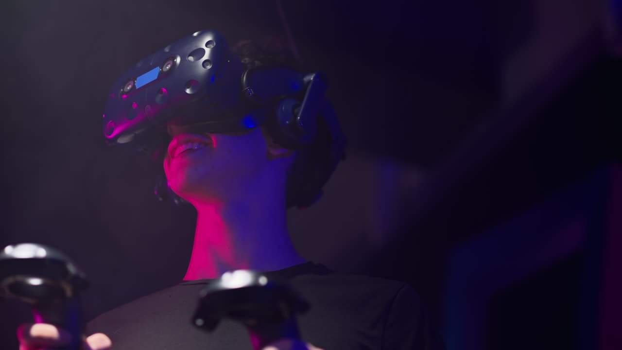 Boy playing with a Virtual Reality headset in a studio