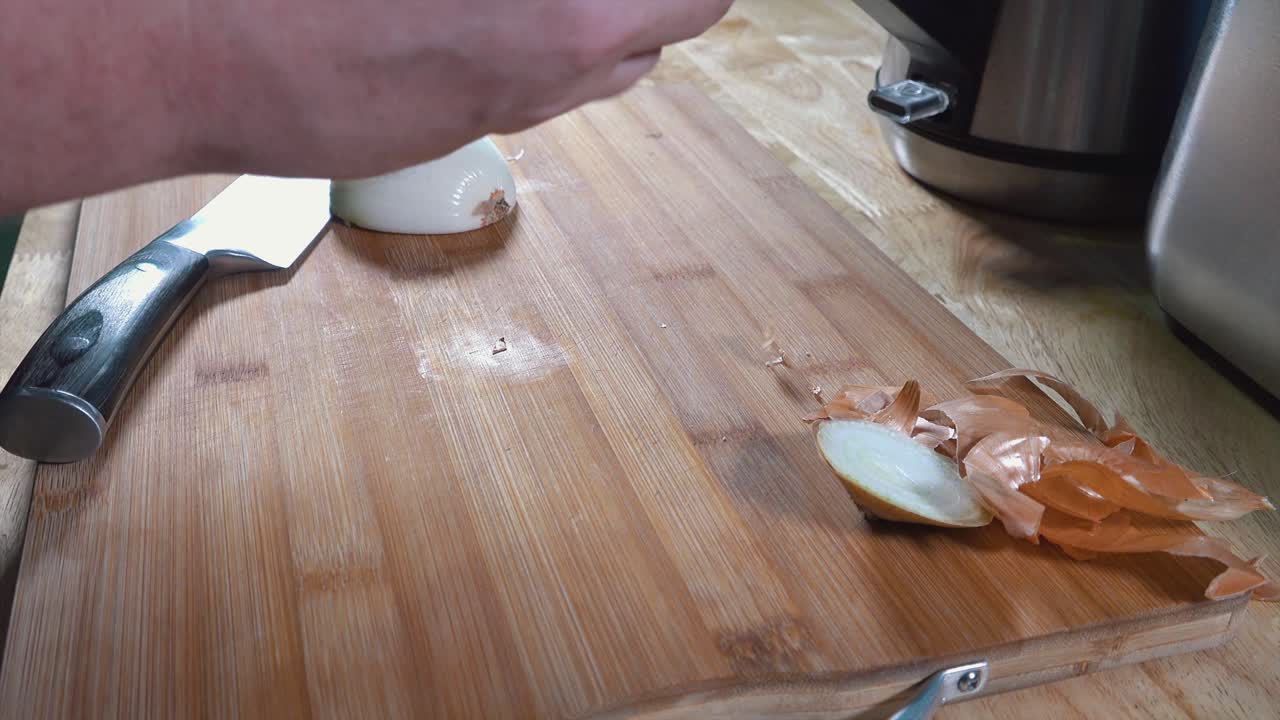 Timelapse of Peeling and Chopping Onions on a Wooden Chopping Board