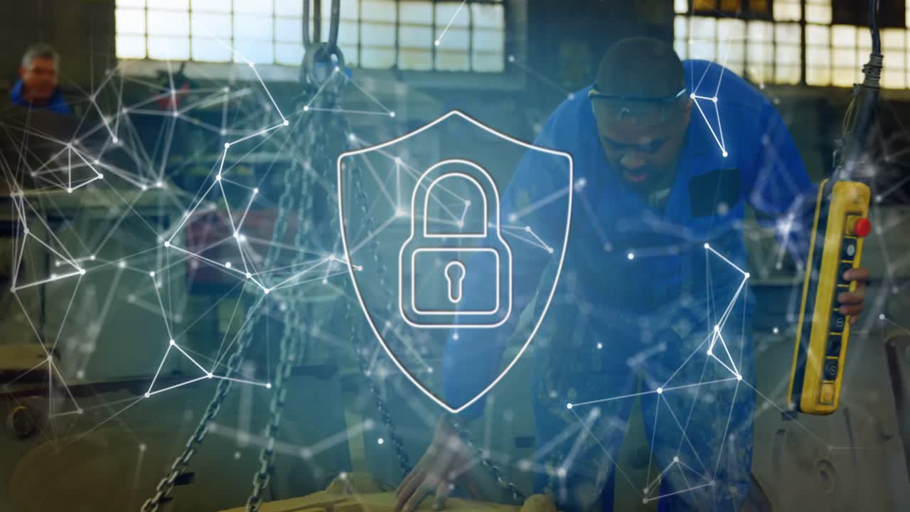 Senior operator lifting pendant and guiding mold in plant while padlock network securing automation