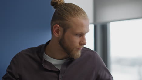 Serious-man-working-office-portrait.-Focused-guy-writing-notes-learning-closeup