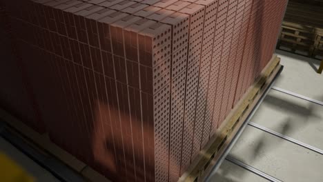 stack of red bricks on a pallet