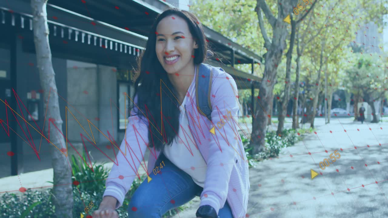 Woman riding bicycle gripping handlebars while red yellow data overlays animating tracking fitness