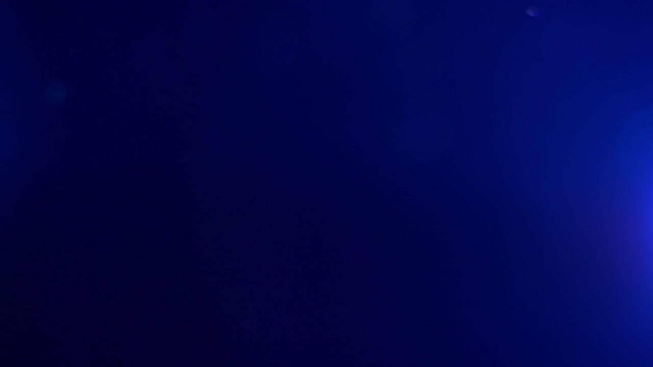 partículas de polvo simples en la luz del proyector