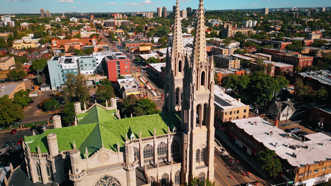 Denver, USA, 28 July 2025: Stunning Cathedral Basilica of Denver, Colorado, USA. Drone flight at the towers of the beautiful building with a view on the cityscape at backdrop