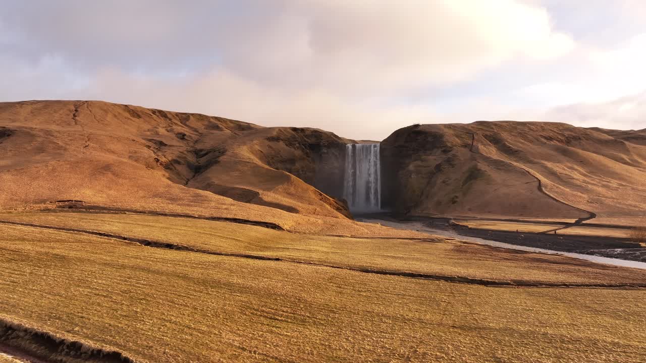 Skógafoss waterfall cascading down a rocky cliff, located in Skógar, Iceland