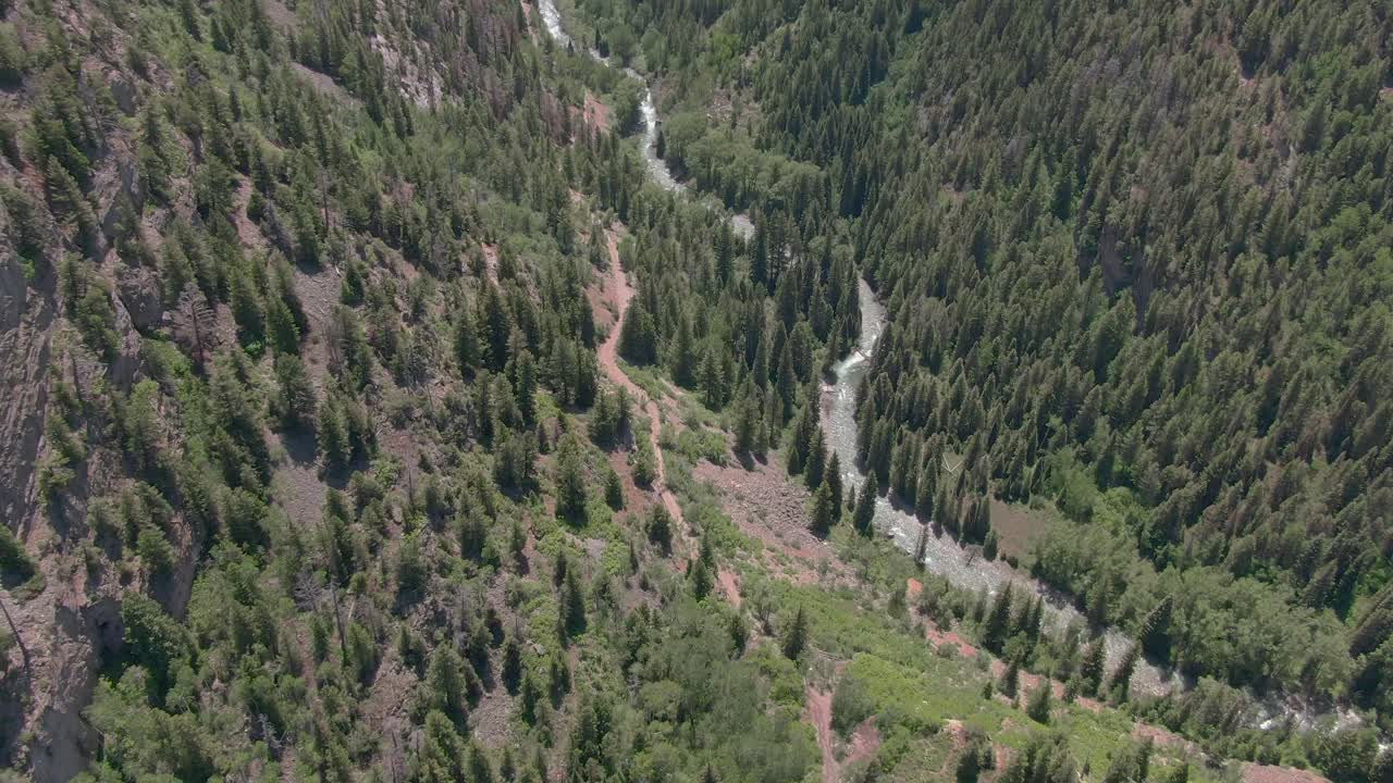 Amazing Birdseye view of mountain lake and paddleboarder.