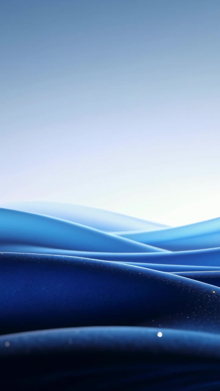 Vertical video: Loop starting, layered blue forms sliding left in device wallpaper, sparks drifting
