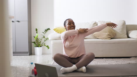 Woman-stretching-at-home