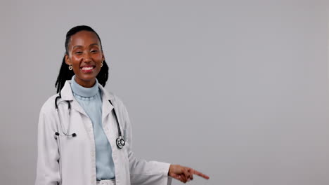 Doctor,-black-woman-is-pointing-with-healthcare