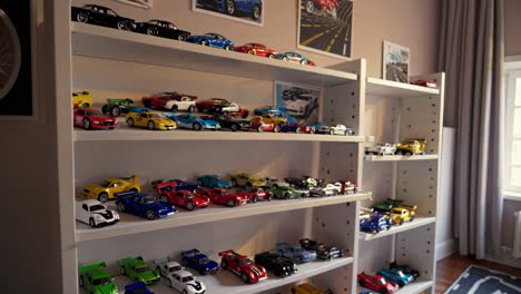 toy car collection on shelves