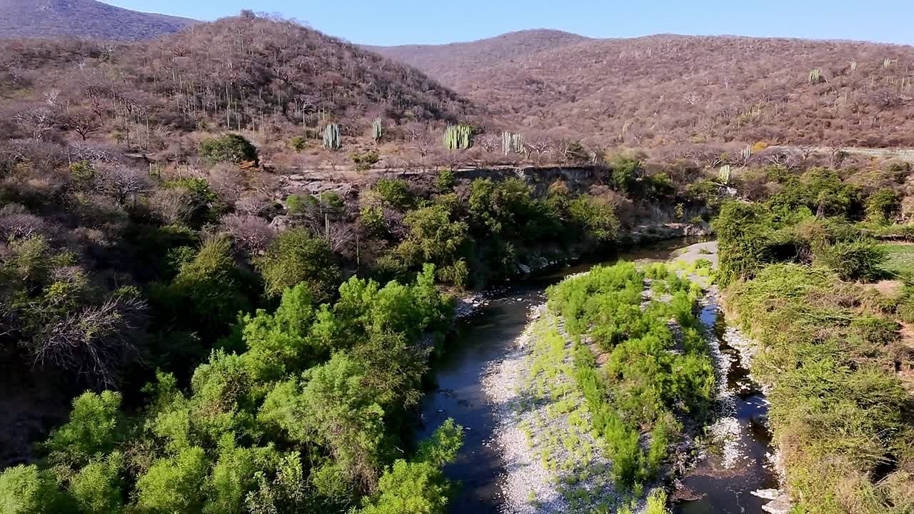 Hills and river view with dry trees, showing natural landscape of Hacienda Ixtoluca, Morelos Mexico