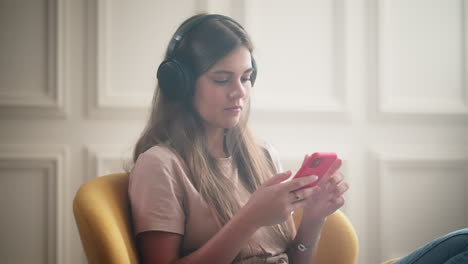 woman relaxing and listening to music on her phone