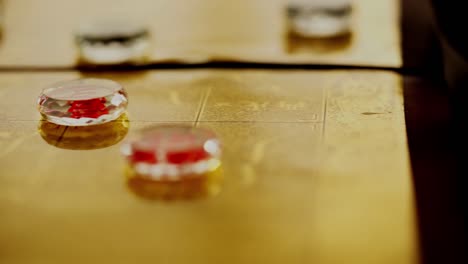 chinese tea set and glass chinese chess on the golden chess board