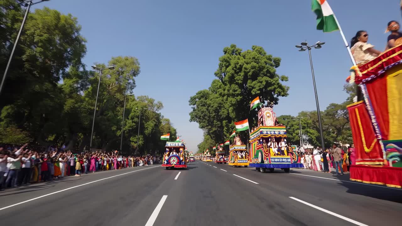 Vibrant parade video from a low-angle, capturing colorful floats and cheering crowds