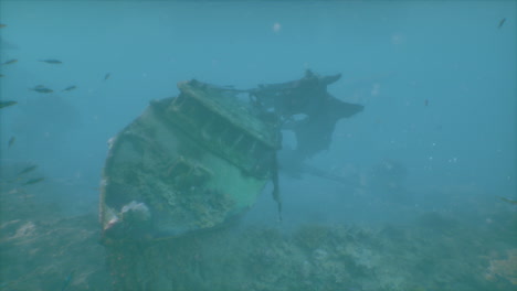 underwater shipwreck with fish swimming around