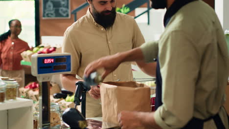 shop owner serving man with produce