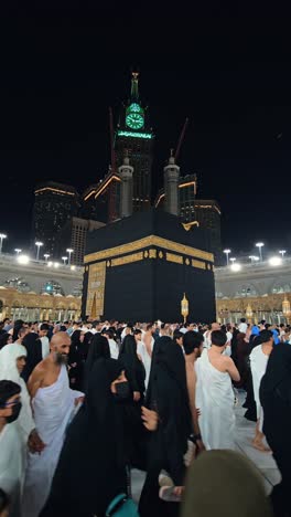 devotees performing the sacred tawaf ritual around the holy kaaba in makkah, saudi arabia.