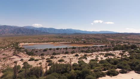 drone advancing over a beautiful dam in the cafayate region