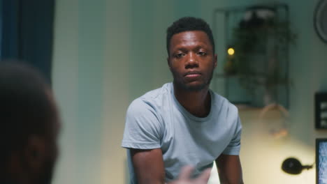 man dancing and singing in a room