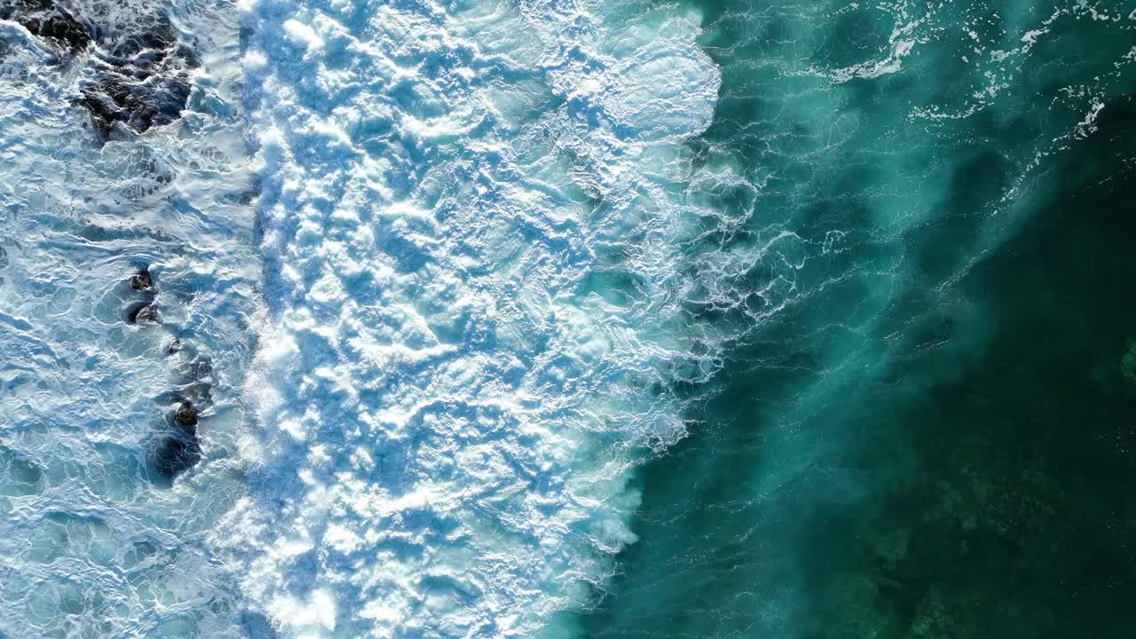 Top-down footage of breaking waves during sunset on the Canary Islands - Lanzarote