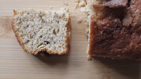 right pan of banana bread cut in half on a wooden board