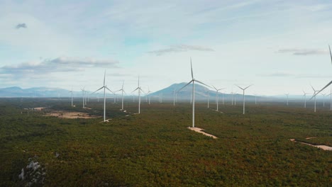 beautiful colorful drone shot of a wind turbine park at dusk