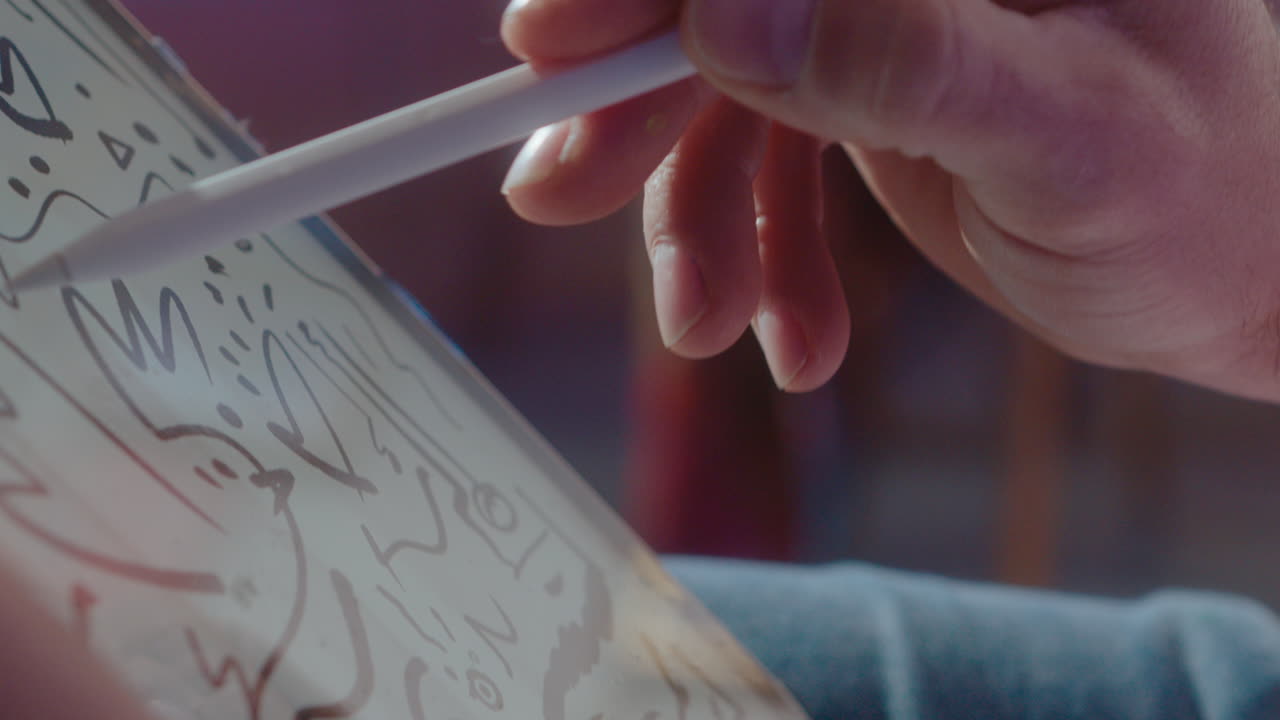 Hands of Illustrator Drawing Sketch on Digital Tablet with Stylus Pen