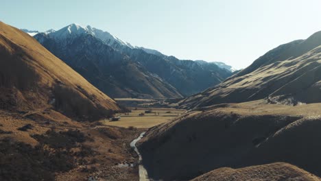 small road through snow capped mountain pass