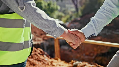 handshake between two people on a construction site