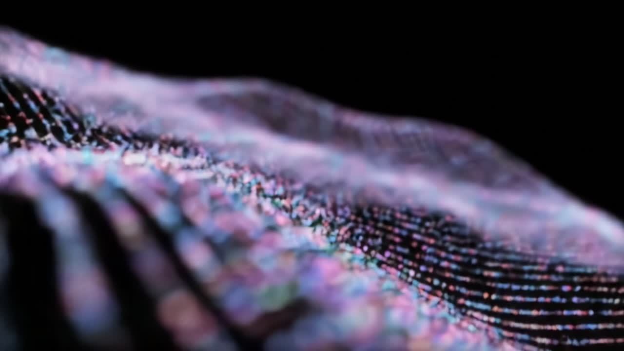 A mesmerizing journey through luminous waves of light and color, showcasing intricate patterns and fluid motion against a deep black background.