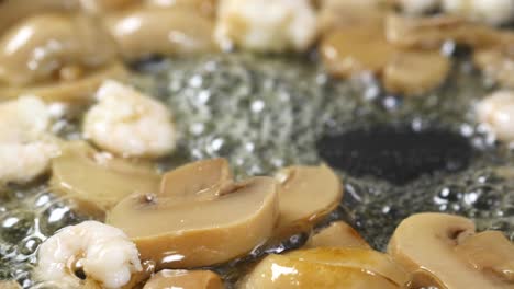 Close-up-of-cooking-mushroom-in-a-cooking-pan-,