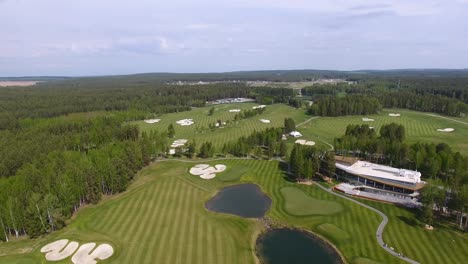 aerial view of a golf course in a forest