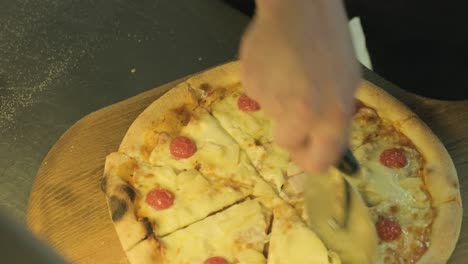 pizza cut into pieces with a knife-wheel