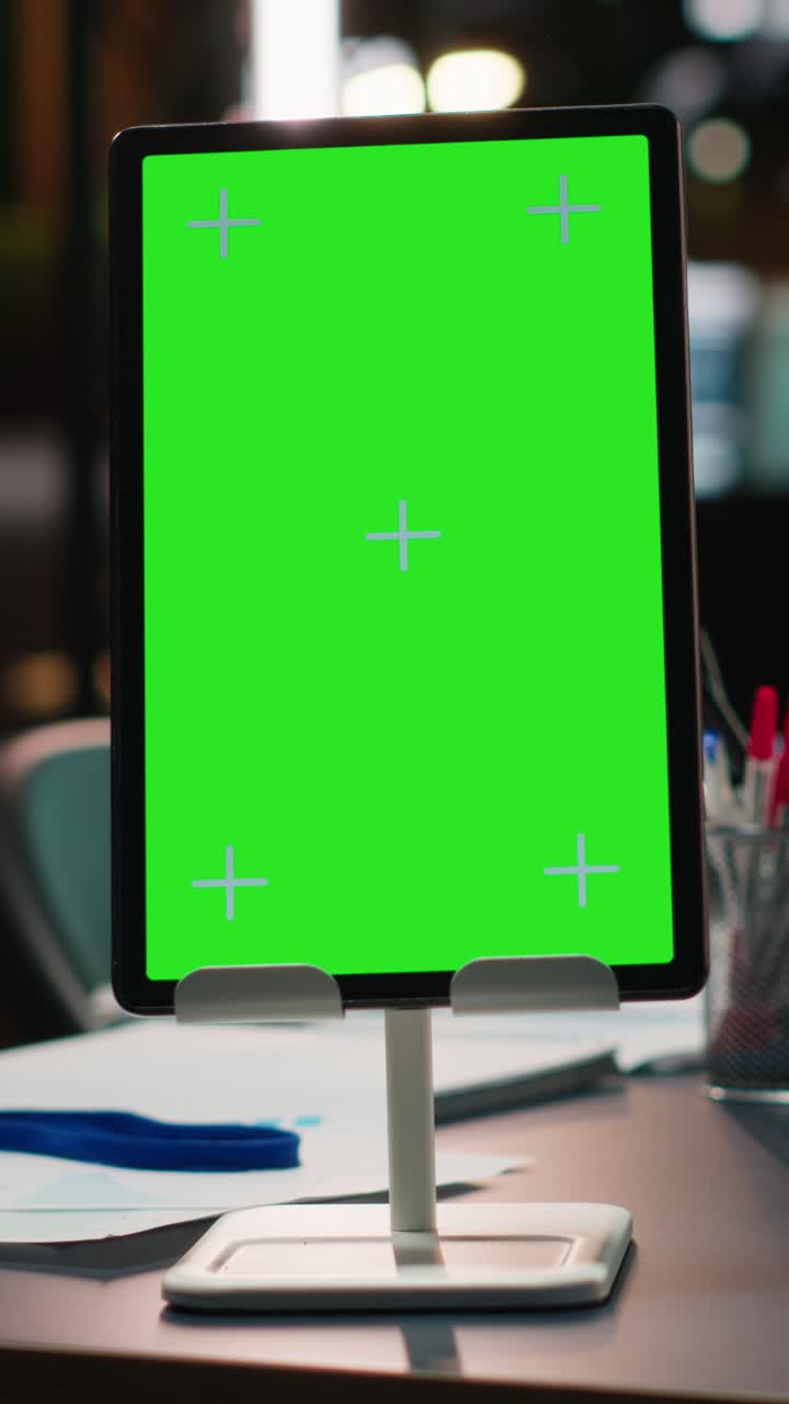 Vertical Video Modern empty boardroom with copy space on tablet and data charts on projections