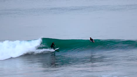 a surfer catches florissant blue wave in california