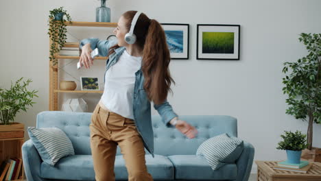 woman singing and dancing at home