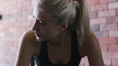 sweaty sportswoman looking away