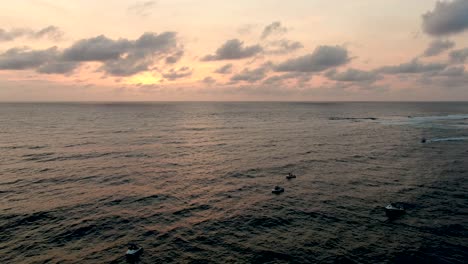 Aerial-View-of-Boats-and-Jetski-in-Indian-Ocean-Sunrise-With-Scenic-Skyline