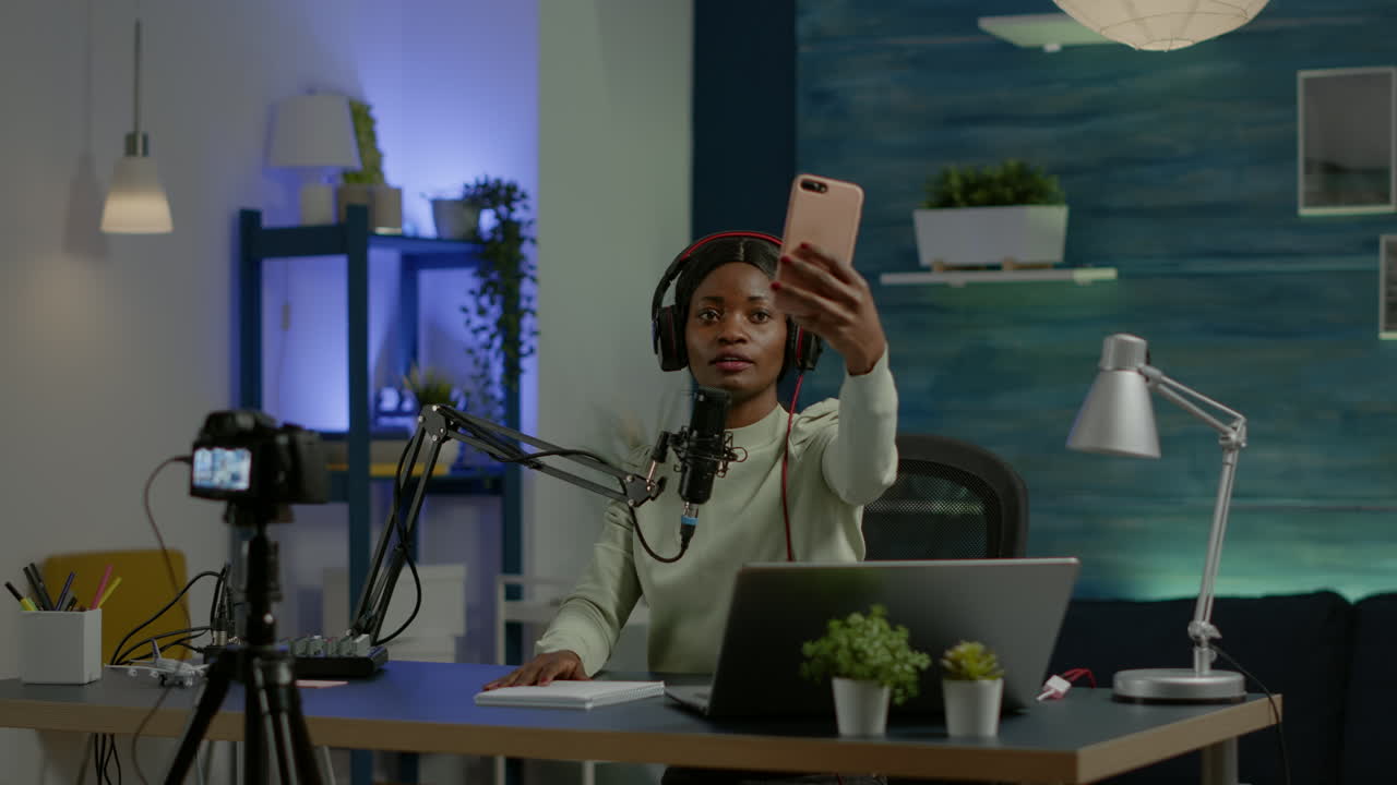 African content creator taking photo with smartphone for fans
