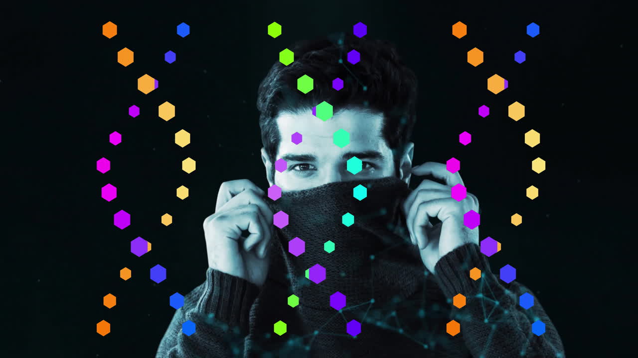 Covering face with colorful hexagon animation overlay, person standing against wall