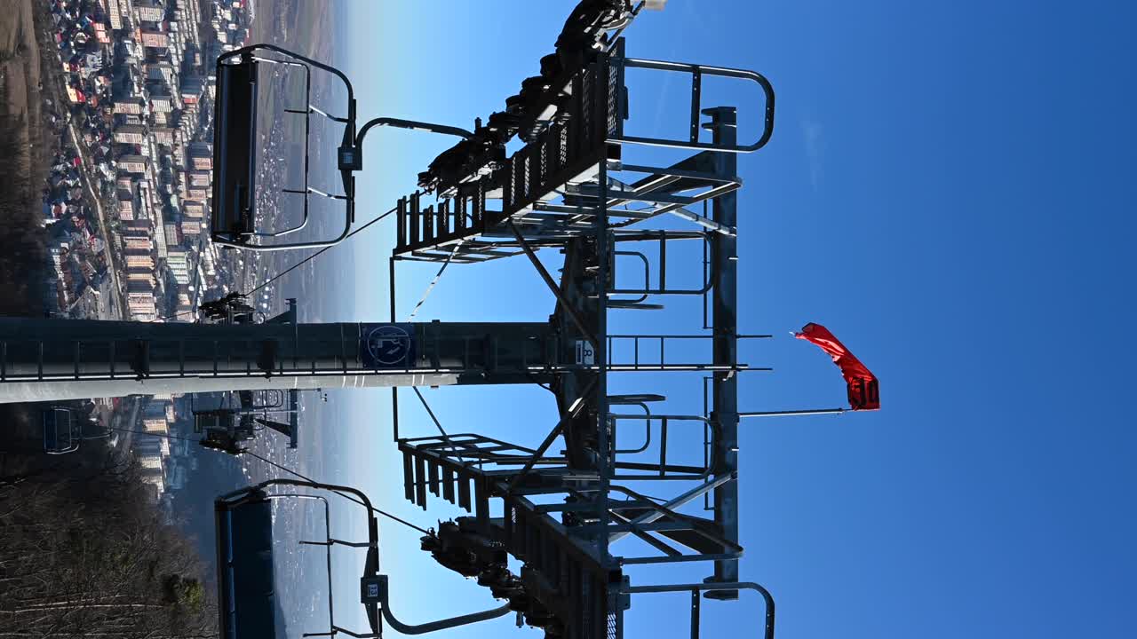 Gondola lift above the mountains in Piatra Neamt, Romania. Vertical